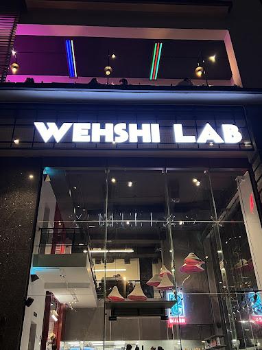 Wehshi Lab is located in DHA Raya commercial Phase 6, Lahore. Wehshi Lab is a fast food restaurant, and it offers chicken burgers, fried chicken, french fries, beef burgers, cold drinks, wraps, and gyro bowls and has other food menus as well.